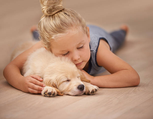 Baby girl with puppy | Family Flooring